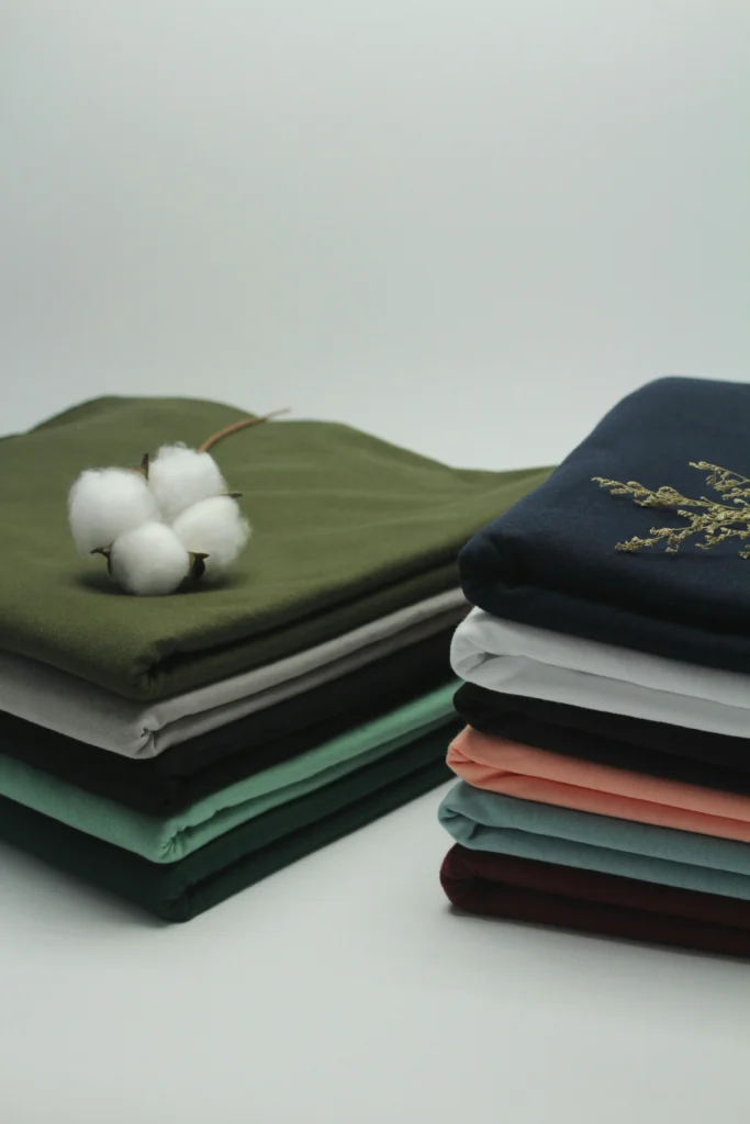 Stay Cool, Stay Stylish: Essential Fabrics for Summer Streetwear - Stack of Cotton Shirts